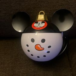 This is a Disney Parks Mickey Mouse Club Snowman Ornament Drink Holder or Mug Mew 