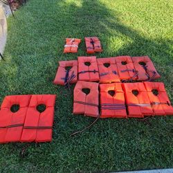 USCG Type II Orange Life Jackets. 2 Adult Super Large, 9 Adult Universal, 1 Child Medium And One Child Small