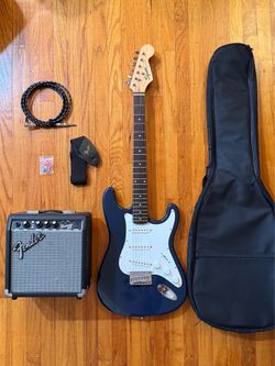 Squier bullet strat and Fender Frontman amp, all accessories