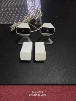 2 Xfinity security cameras (outdoor)