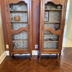 two antique curio cabinets