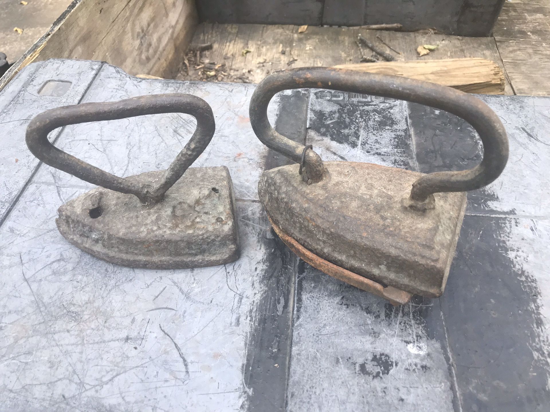 Two different size antique irons holder