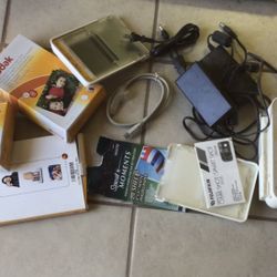 KODAK PRINTER AND ACCESSORIES  AND INCLUDES THE CORDS 