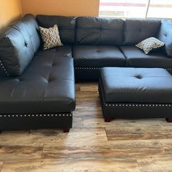 New Reversible Nailhead Sectional .  Espresso Leather .  104” X 75”.  Free Delivery !