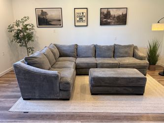 Gray duck down filled sectional couch delivery available