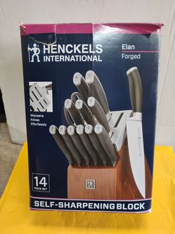 Henckels International Elan 14-piece knife set features a specialized self-sharpening block designed to maintain blade edges effortlessly