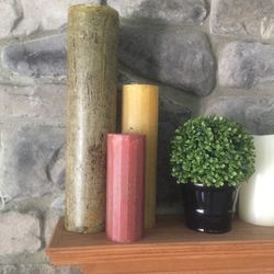 Real Candles   Never Lit   2-4”x18”; One Orangish Color And One Sage Green  2-3”x12” Both A Yellow Gold Color; 1 3”x8” Burnt Orange And One 