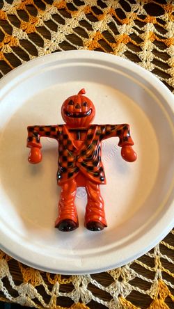Vintage 1950s Halloween hard plastic scarecrow, jumping jack candy holder