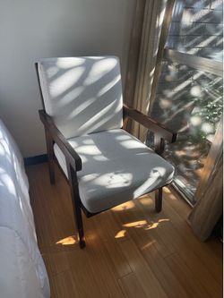 White cloth chairs wood frame