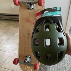 Used Skateboard and New Adult Helmet