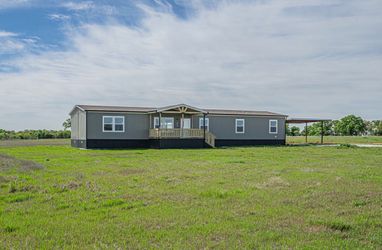 5-bedroom, 3-bath double wide home, move-in ready, located in Sunset, Texas on 4 acres.