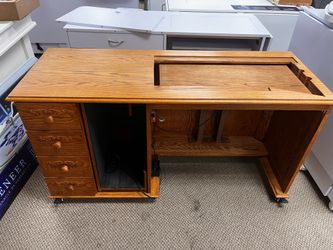 Sewing cabinet with electric lift. Custom made.