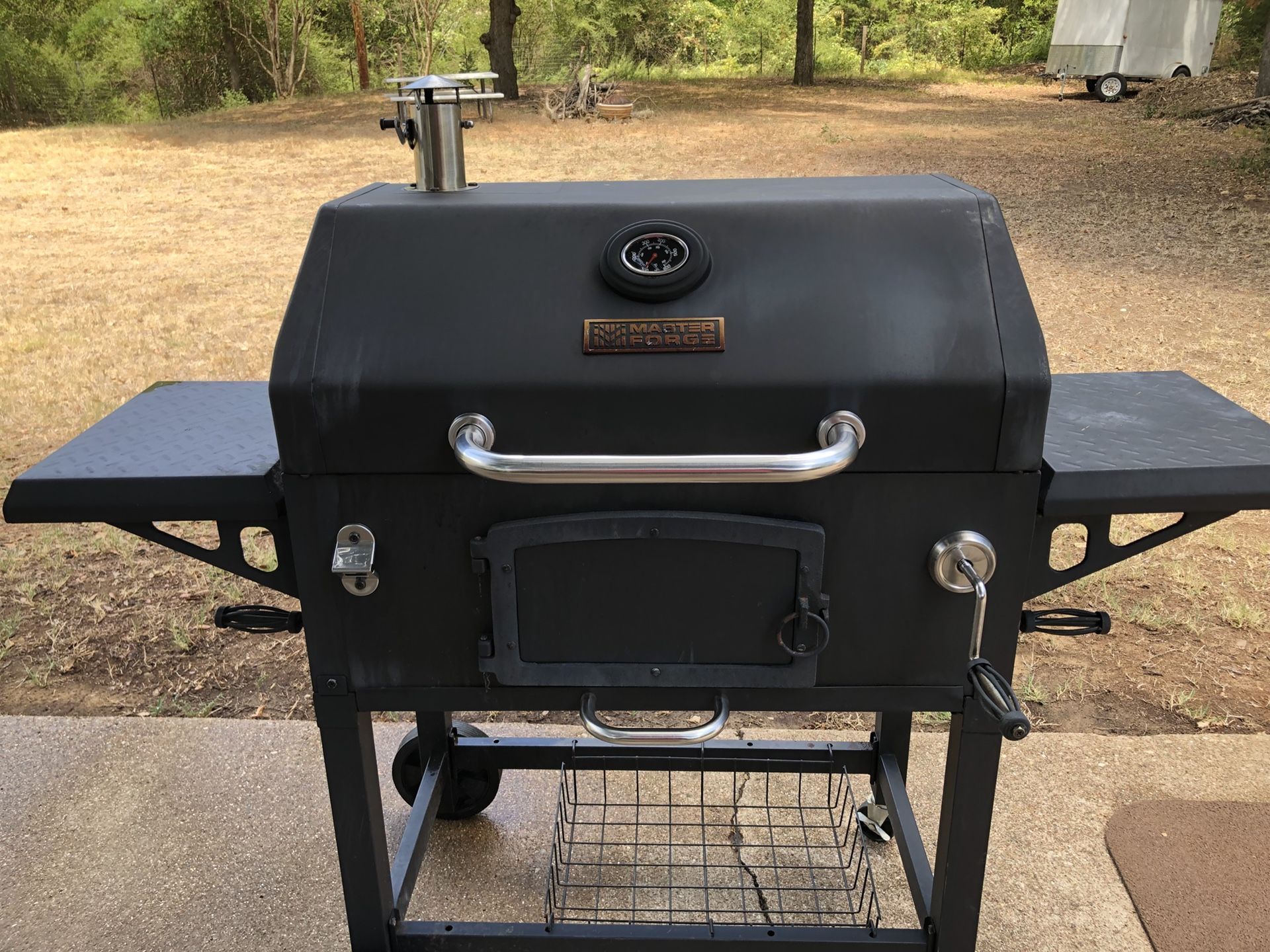 Master Forge Smoker with fireproof grill mat and cover