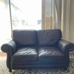 Brown leather loveseat 