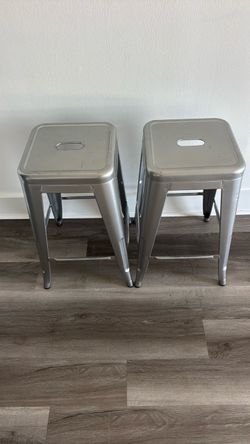 Two aluminum stools