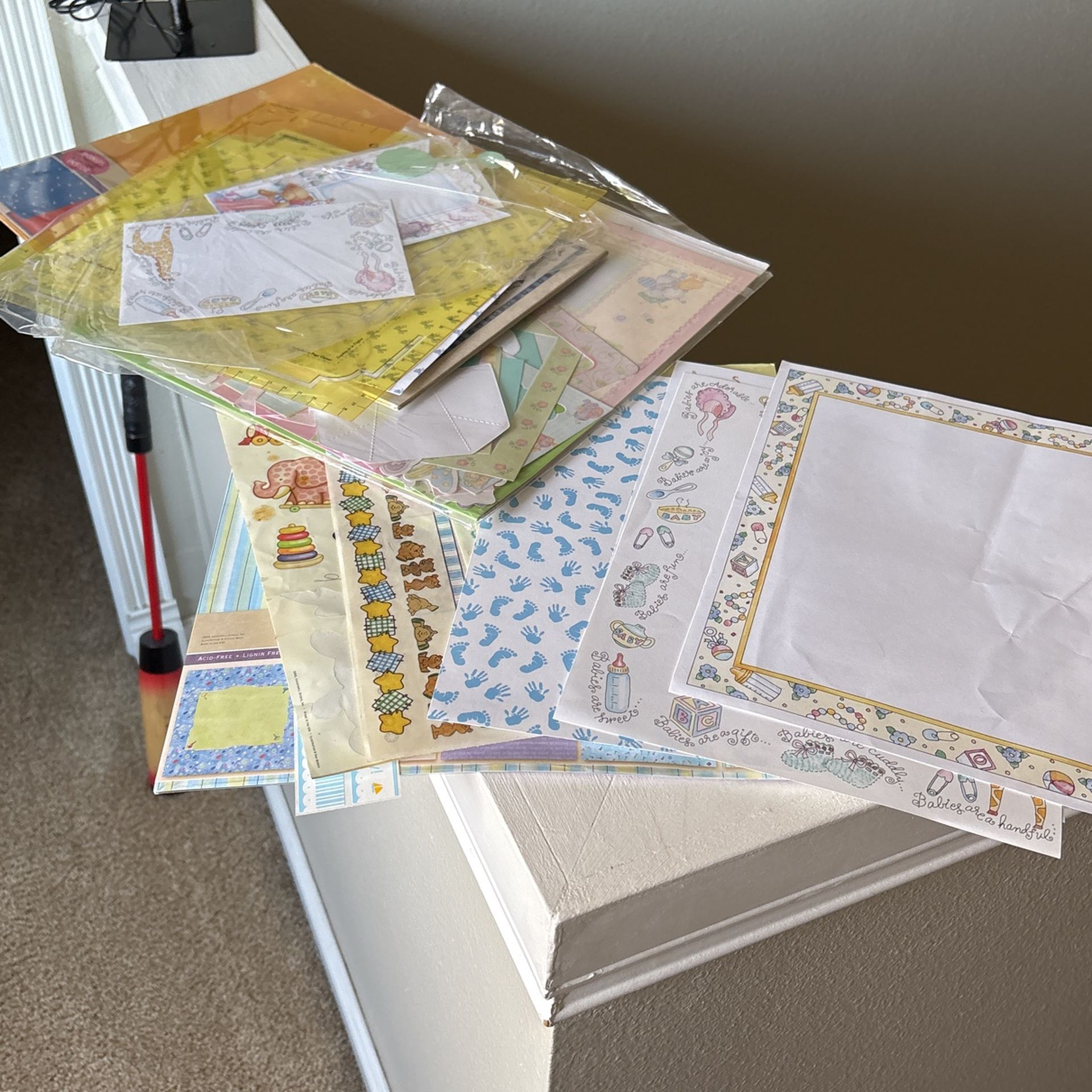 Baby related assortment of scrapbooking supplies