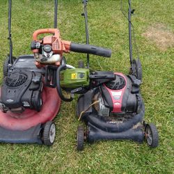 2 Lawn Mowers A Blower And Chain Saw 