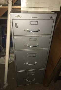 Filing cabinet. Locks. Heavy duty. Doors open very smoothly