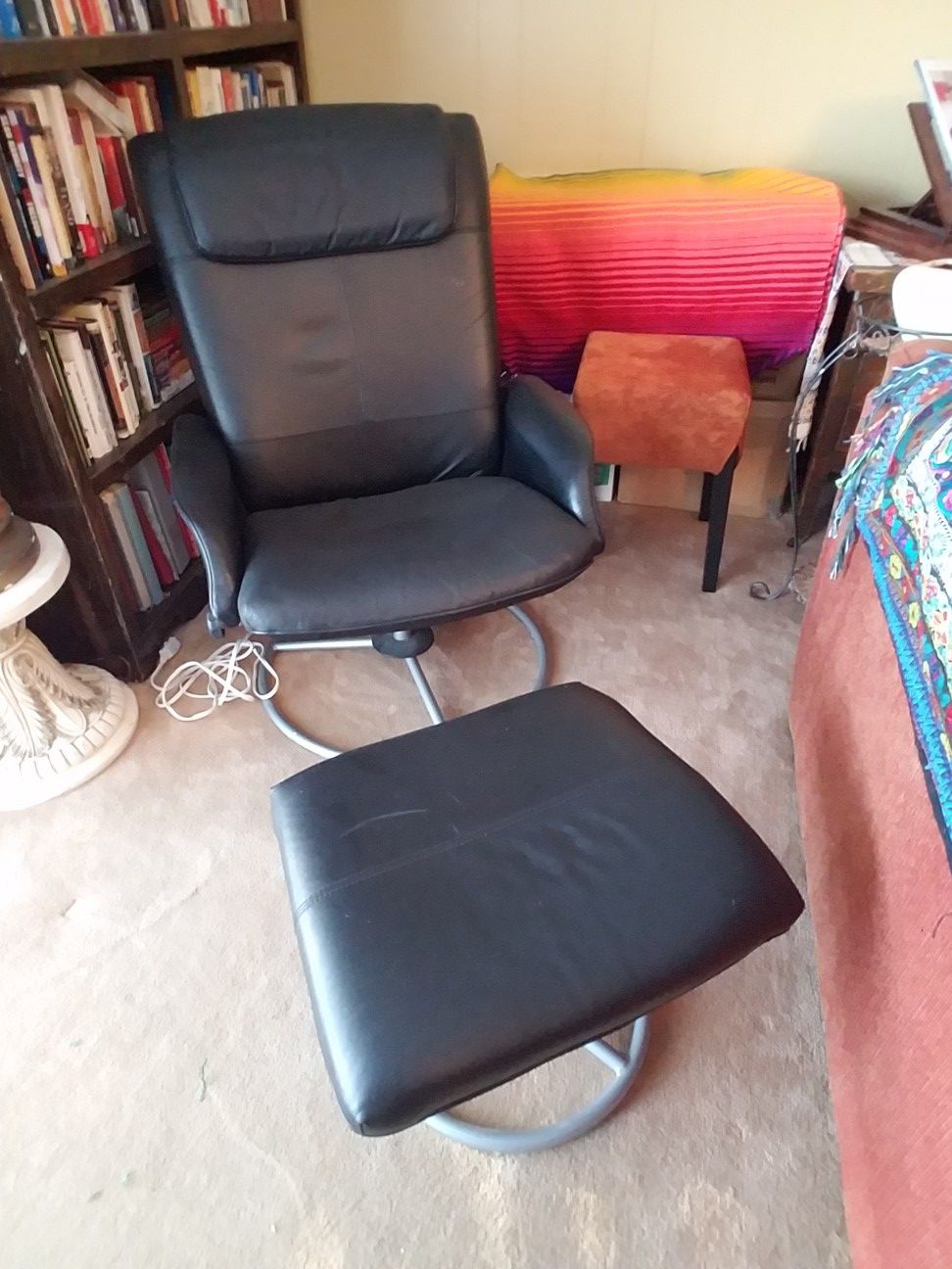 Ikea leather-look black chair and ottoman