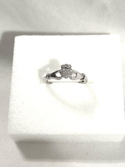 Brand new 16 authentic diamonds set in .925 silver promise ring. Size 7.