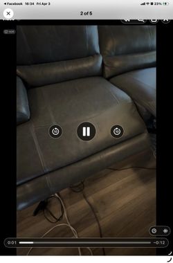 Gray leather reclining sofa gently used