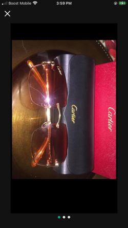 Gold Cartier Rimless Frames With Red Tinted Lenses