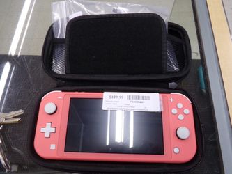 NINTENDO SWITCH LITE  CORAL PINK WITH EXTRAS