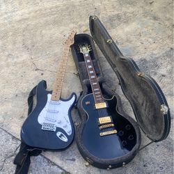 Left Guitar Behringer And Right Gibson Epiphone