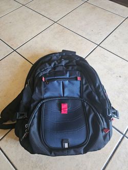 Backpack with phone charger in laptop.