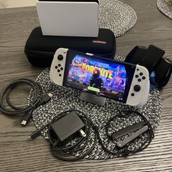Nintendo Switch Oled with Box + Original accessories + Grip w/ carrying case