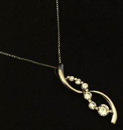 Sterling silver high-grade CZ diamond twirl pendant