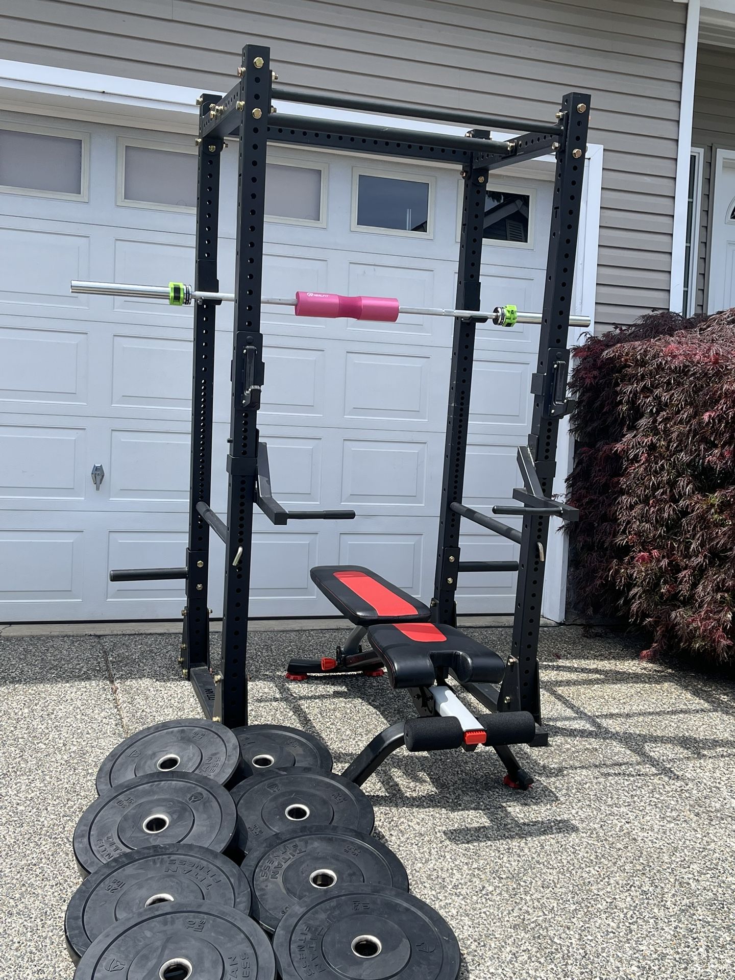 Heavy duty Titan X-3 Series Flat Foot Power Rack with olympic bumper plates, barbell and bench