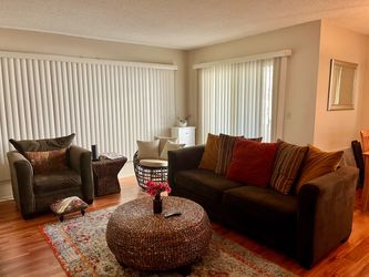 Couch and arm chair set with decorative pillows