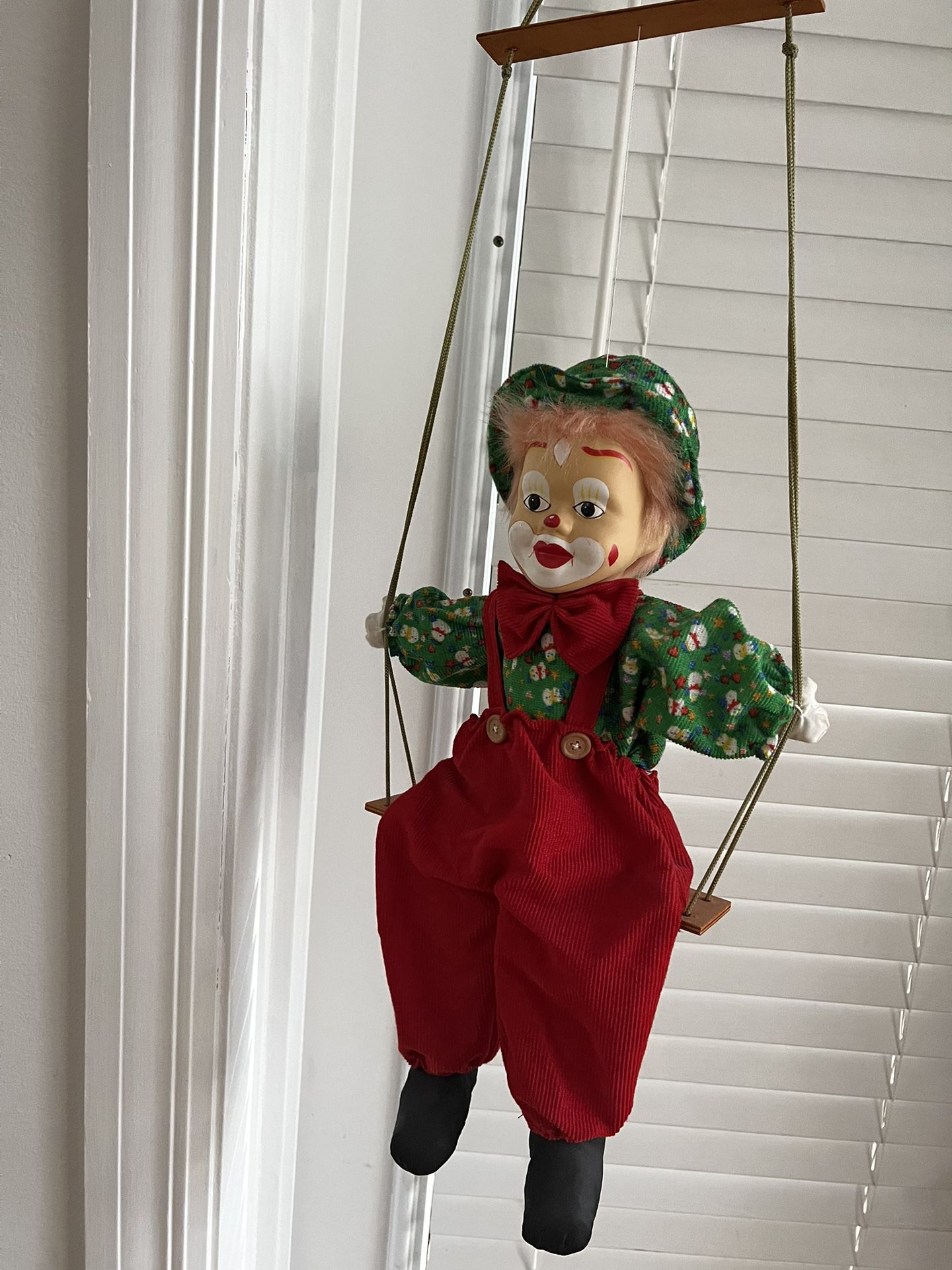 large vintage clown on swing soft bodied clown with porcelain face red hair collectible  In great condition  Approx 31 inches tall  Body of the clown 