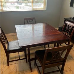 1920’s solid cherry wood dinning table with detachable leaves. 