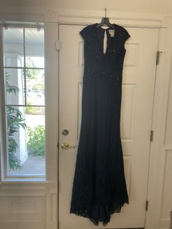 Amazing Tony Bowls long ballgown. Used once for pageant. Navy Blue. Excellent condition. Size 6