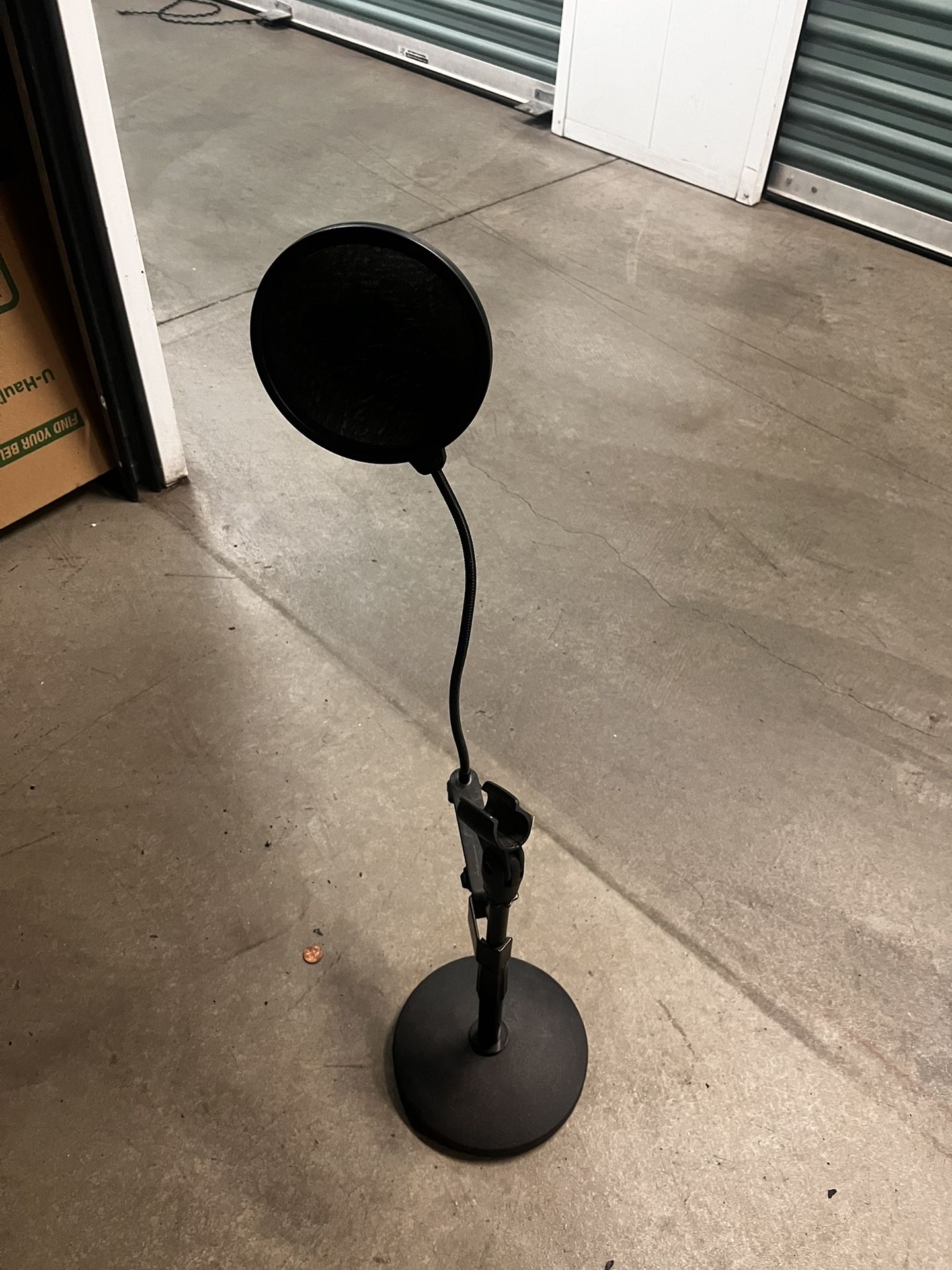 ProLine Round Base Desktop Microphone Stand with an attached pop filter.