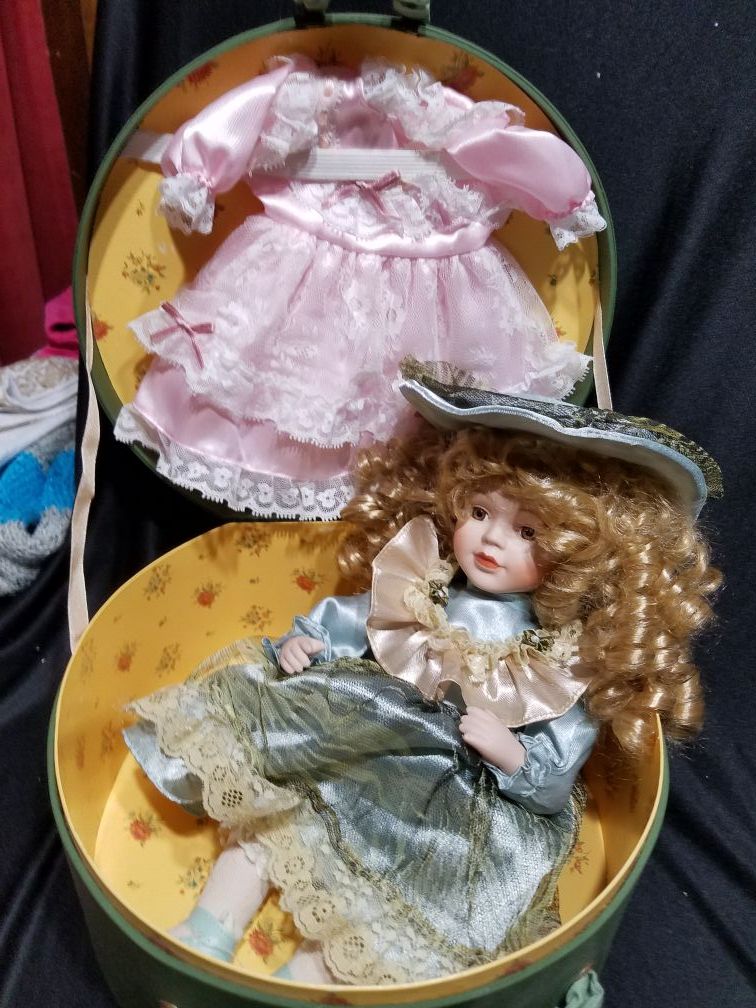 Brand new Porcelain doll with carrying case