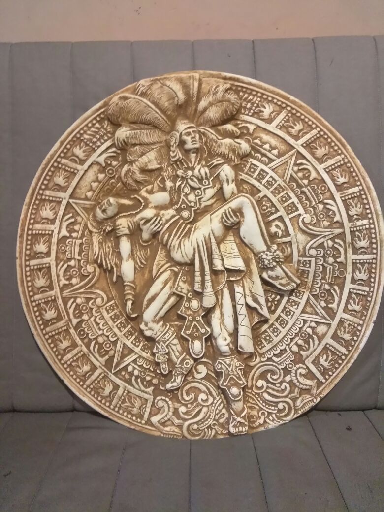 Aztec calendar with warrior carrying woman