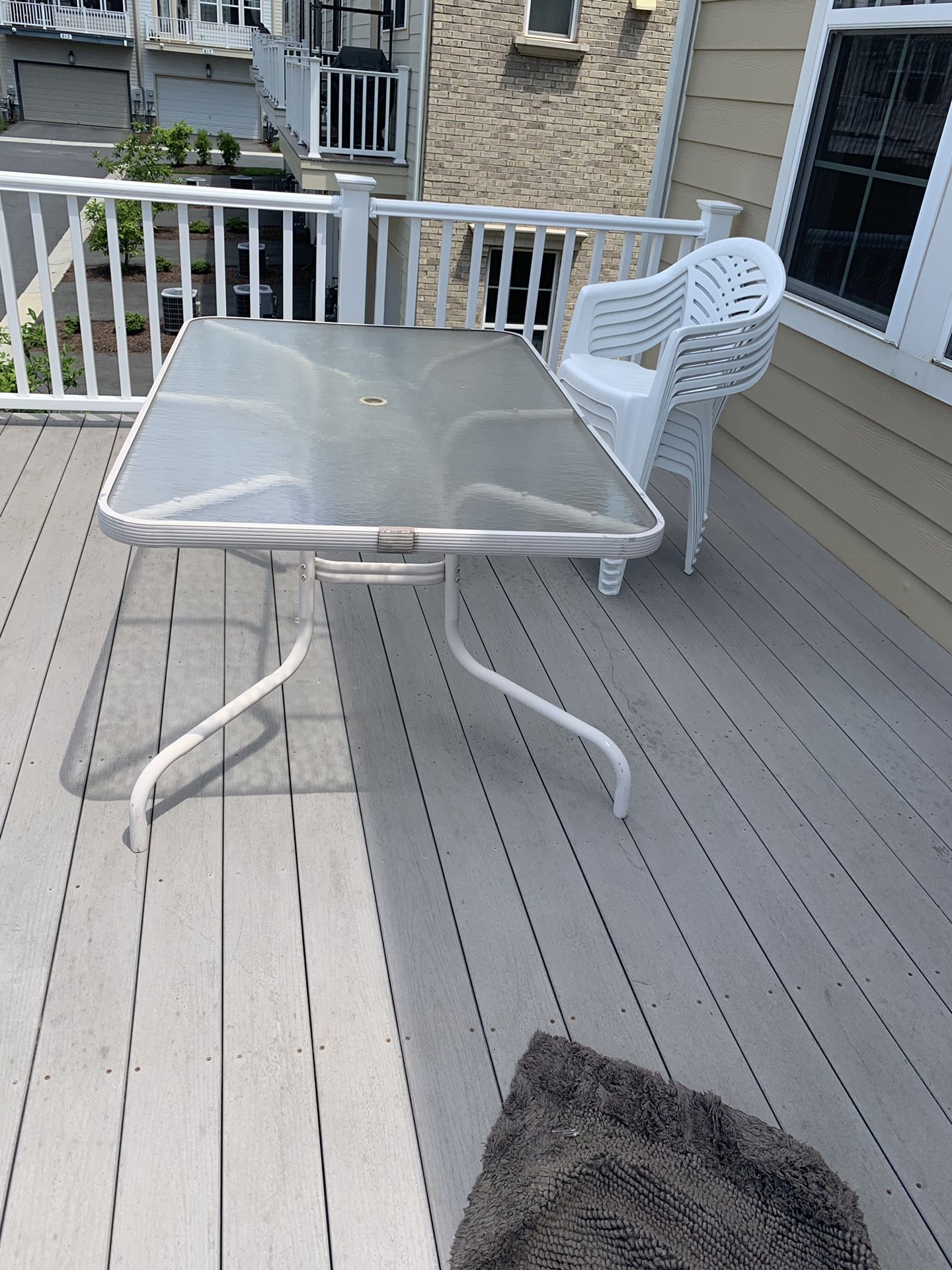 Glass patio table with 4 plastic chairs perfect for bbq — free if picked up before thursday!