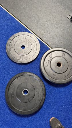 Workout bumper plates with steel inserts for Olympic bars. $1 per pound
