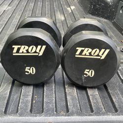 PAIR  OF  TROY  50 LB.  BARBELL  12  SIDED  URETHANE  RUBBER  DUMBBELLS. 
