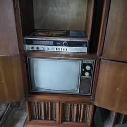 TV Stand and also a TV and a player .