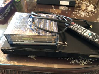 Samsung BD-C5500 Blu-ray/DVD player and 4 brand new Blu-ray movies!