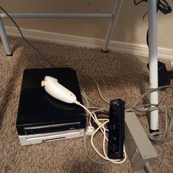 Two Nintendo Wii (white and black consoles)