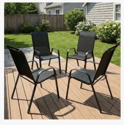 Set of four black patio chairs