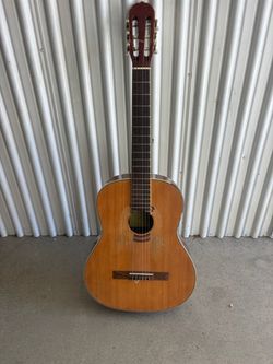 Used acoustic guitar