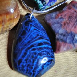 KNOWN AS THE MYSTIC OF GEMSTONES, DRAGON'S VEIN, BLUE. ON A STERLING 18-in CHAIN