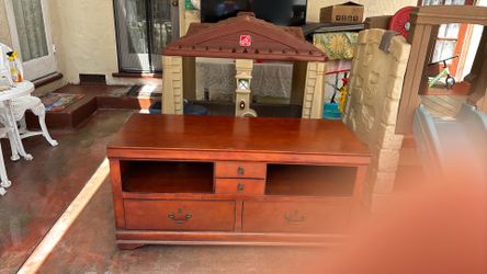 Wooden table or TV stand on wheels