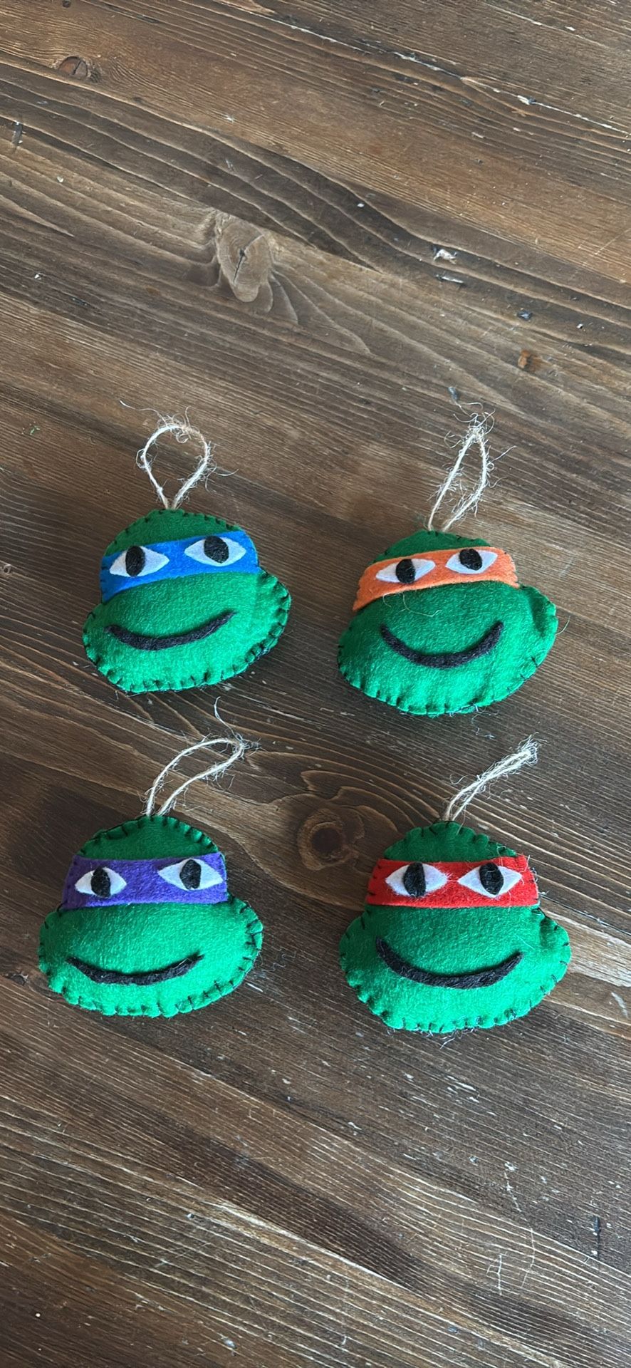 set of 4 felt Teenage Mutant Ninja Turtle Christmas ornaments.  Like new. Cute!